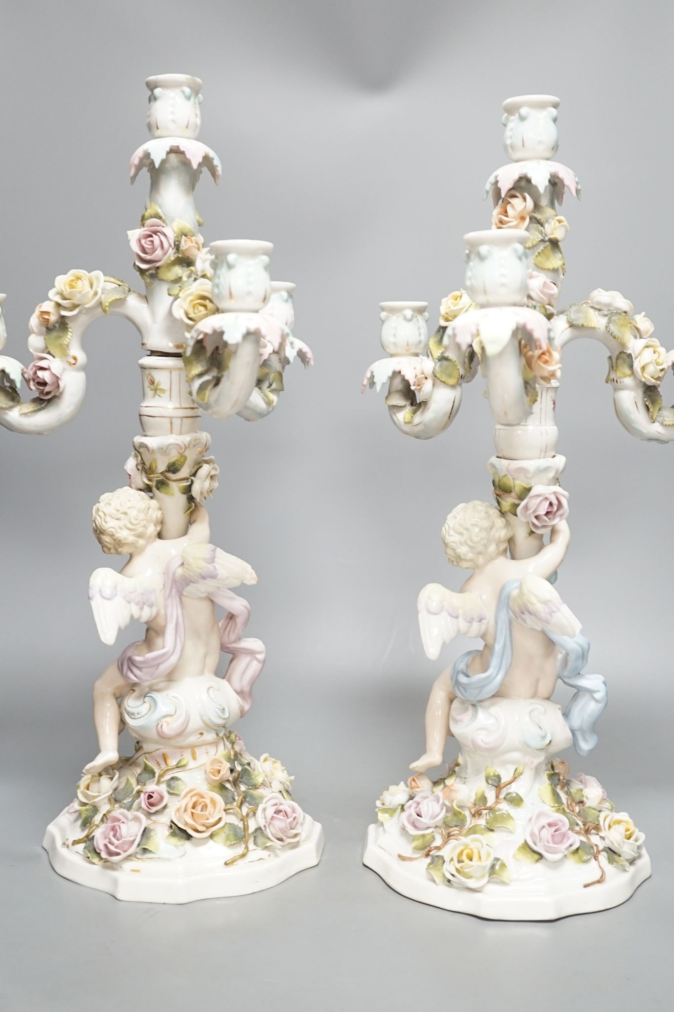 A pair of Sitzendorf 'cherub' candelabra 50cm